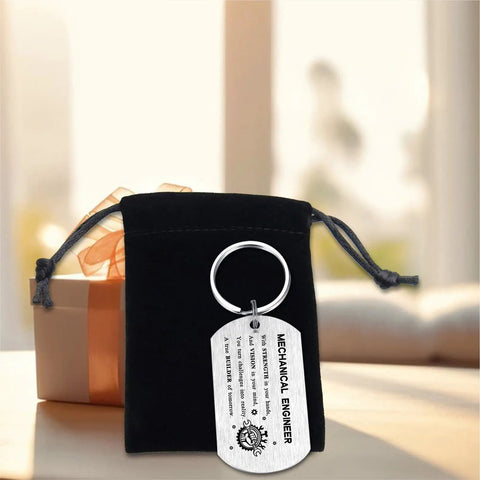 Gearhead Mechanical Engineer Gift Keychain For Students And Pros in stainless steel with black pouch on table
