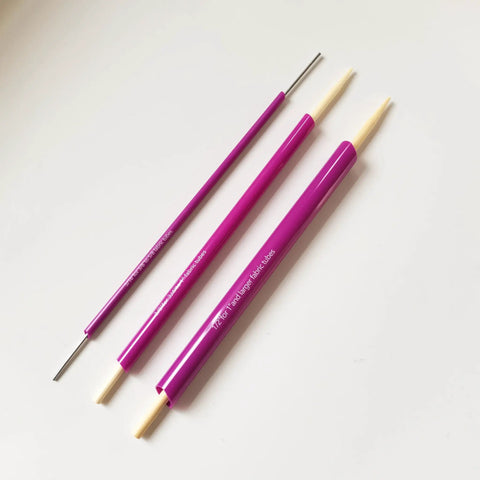 Versatile Fabric Tube Turner Set For DIY Sewing With Three Cylinder Sizes One Sixteenth Inch Three Eighths Inch And One Half Inch Plus Ball Point Bodkin Drawstring Threader For Easy Tube Turning And A Handy Must Have Tool Bundle, shown with purple cylinders and bodkin tool.