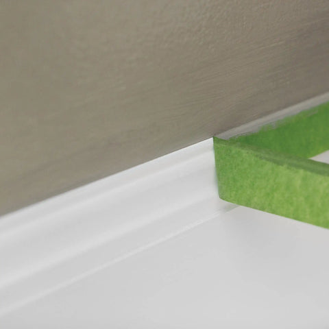 DIY Friendly Pro Grade Multi Surface Painter Tape With PaintBlock Technology For Sharp Lines applied on white trim and wall