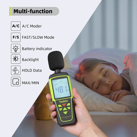 Person using Portable Decibel Meter With 30 To 130 dB Range, 5 Measurement Modes, Backlit LCD Display, MAX MIN Readouts, near sleeping child