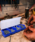 Open blue toolbox style storage case showing four compartments with screws and bolts, part of 12 Pack Screw Organizer Boxes With Lids.