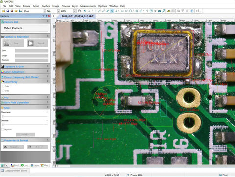 Close-up view of a PCB under inspection using a 48MP C Mount Digital Microscope Camera For PCB Soldering And DIY Repair, 1080P60 HDMI USB Live View