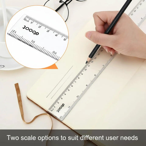 Person using 20 Pack Bulk 12 Inch Clear Plastic Rulers Set With Inches And Metric For Classroom Use Easy To Read Straight Edge Rulers