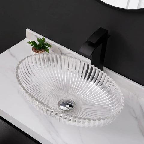 USZWBY Bathroom Vessel Sink Bathroom Crystal Glass Vessel Sink Clear Oval Shape Transparent Basin Bathroom Sink on marble countertop.