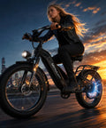 Rider using Powerful 2000W Peak Electric Mountain Bike With 864Wh Battery And Step Through Frame Delivers 40 To 80 Mile Range On Fat 24 Or 26 Inch Tires Full Suspension For Off Road Trails And Daily Commuting at sunset on city street