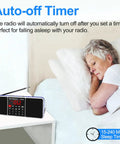 All In One Digital FM Radio Speaker MP3 Player with sleep timer on bedside table, woman sleeping, blue finish