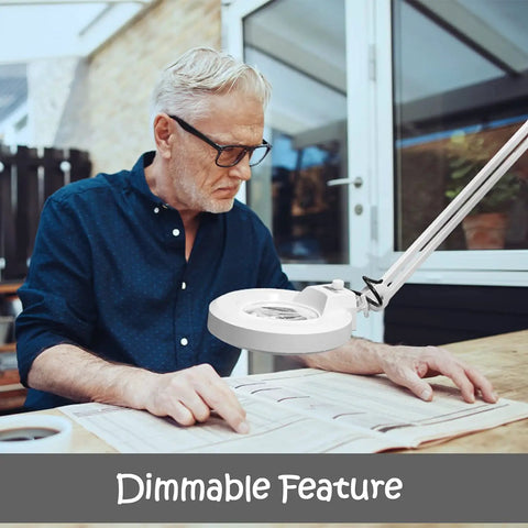 Man reading under LED Floor Lamp With Magnifying Glass Light For Reading And Crafting, adjustable and dimmable, 5 inch lens