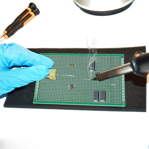 Soldering practice on a 10 Pack Double Sided FR4 PCB Boards 9x15 Cm Solderable Prototyping Board with components.