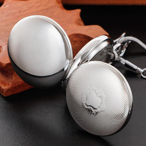 Silver Shield Mechanical Pocket Watch For Men With Double Cover Roman Numeral Dial Chain Included Vintage Dress Timepiece For Everyday Carry Great Gift For Him, showing closed textured double cover on wooden surface