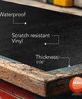 Heavy Duty 15 X 36 Inch Work Bench Mat With Scratch-Resistant 0.06 Inch PVC Protects Your Workbench, Table, And Tool Station From Painting, Woodworking, Crafting, And Building Messes Black Made In USA on a wooden surface.