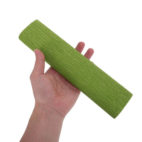 DIY Crepe Paper Flower Kit With Precut Sheets And Metal Wire For Realistic Bouquets Easy To Shape Flowers All In One Floral Stem Craft Set For Weddings And Scrapbooking green crepe paper sheet held in hand
