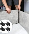 Person installing heavy duty L shaped corner brace set of 4 stainless steel right angle brackets for shelves tables chairs repair