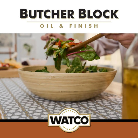 Wooden salad bowl being filled with greens; Straight Up Food Safe Butcher Block Oil And Clear Wood Finish That Offers Rapid Cure Time and Kitchen Ready Shield For Cutting Boards While Keeping Wooden Surfaces Looking Sharp And Fully Sealed.