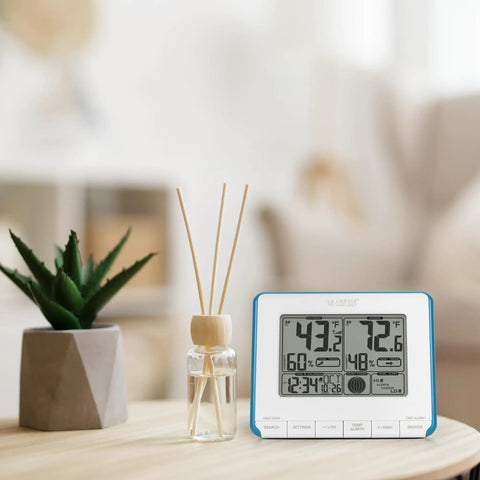 Wireless Weather Station All In One With Heat Index And Dew Point Indoor Outdoor Temperature And Humidity Monitor Teal Blue And White Display on a table