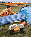 Beefy Heavy Duty 12V DC Double Cylinder Tire Inflator near tent with air mattress outdoors