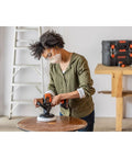 Person using Matrix 20V Max Buffer Kit For Cars Floors And Furniture With 3500 RPM Random Orbital Polisher, Cordless Power Unit, Battery