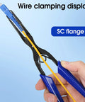 Blue-handled flange fiber optic pliers holding a yellow fiber for SC/LC connectors.
