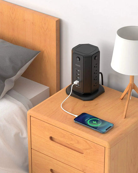 10-Foot Power Strip Tower With Eight Outlets And Five USB Ports, Dope Surge Protector on bedside table charging phone