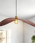 33.4" Large Wood Pendant Lights, Mid-Century Modern Natural Black Walnut Wood Pendant Light Fixture in a cozy living space.