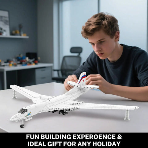 Person assembling White Swan Fighter Building Block Set 33036 With 1598 Pieces Realistic Military Bomber Aircraft Model Kit