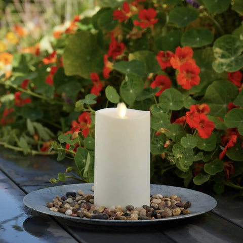Outdoor Flameless LED Ivory Candle With Melted Edge, 3.75 x 7 Inches, Real Moving Flame in garden setting