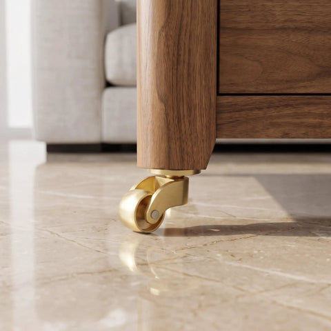 Heavy Duty Vintage Brass Swivel Caster Wheels With Cushioned Rubber Tread Set Of 4 on wooden furniture leg.