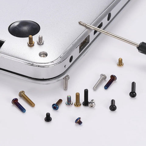 KickAss T6 Torx Pocket Clip Screws For Folding Knives Black Oxide Finish 2-56UNF Threads on a laptop corner.