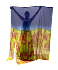 A performer holding vibrant soft chiffon worship flags for dance with flexible rods, showcasing fluid movement and color.