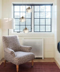 Modern Raindrop Pendant Lights Set Of 3, Brass Round Hanging Lamps With Clear Crystal Prisms in cozy room corner