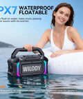 Woman using Beast 100W Bluetooth Outdoor Speaker With IPX7 Waterproof Floatable Design in pool.