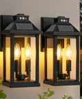 Super Bright Solar Porch Lights With Smart Motion Sensor Sconce Natch Kicks On Yard Fence And Patio For Straight Up Security And Super Fly Nighttime Glow, black lanterns with clear glass and warm glow.