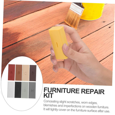 Hand holding wax stick from Floor And Tile Repair Wax Kit For Porcelain And Ceramic Tiles Quick Drying Hard Wax Filler For Chips And Scratches