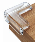 Top Notch Baby Corner Protectors 16 Piece Clear Table Edge Guards on a wooden surface, designed for safety and cushioning.