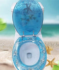 Heavy Duty Resin Toilet Seat With Lid Boasting Vivid 3D Ocean Details And Smooth Shell Motifs Soft Close Bath Accessory Breeze Install For Universal Oval Designs, top view with ocean-themed design.
