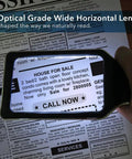 3X Large Lighted Magnifying Glass With Anti Glare Lens And Stepless Dimmable LEDs highlighting text on a newspaper, reading aid.