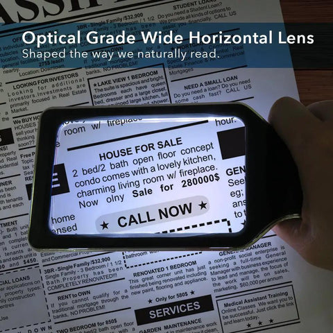 3X Large Lighted Magnifying Glass With Anti Glare Lens And Stepless Dimmable LEDs highlighting text on a newspaper, reading aid.