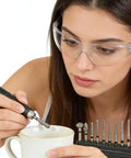 Woman using Pro Grade Diamond Coated Rotary Burr Set With 50-Piece Assorted Grinding Bits for fine detail work, 1.6 mm shank