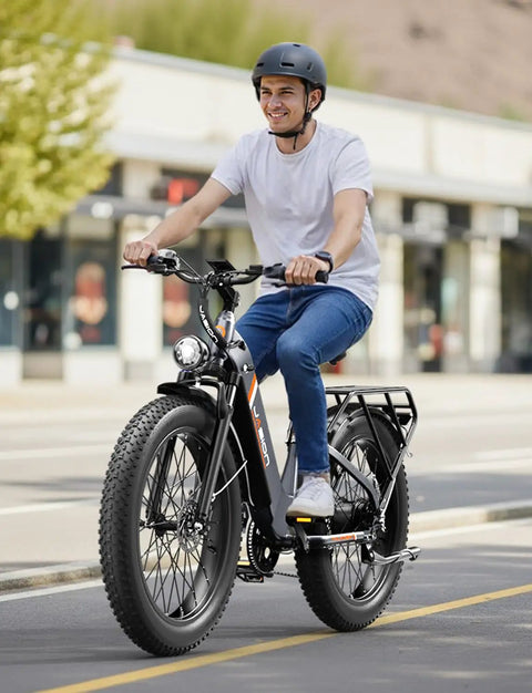 Man riding 1800W Peak Fat Tire Electric Bike For Adults with 26x4 Inch Tires, 864Wh Removable Battery, on city street