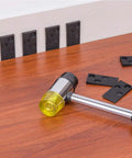 Pro Grade Laminate Flooring Installation Kit with spacers and heavy duty mallet on wooden floor