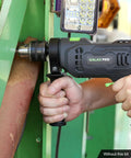 Beast Corded Hammer Drill With 4.5 Amp Motor 0 To 3000 RPM 1/2 Inch Keyed Metal Chuck 2 In 1 Hammer And Drill in use on metal