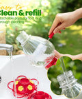 Person cleaning Outdoor 20 Oz Hummingbird Feeder With Ant Moat And Six Feeding Ports Perch Nectar Feeder For Garden Yard Deck Easy Hang No Fuss Attract More Hummingbirds With Bright Red Base And Realistic Flower Ports under tap