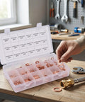 Go-To Copper Crush Washer Set Kit 350 Pcs in 18 Sizes for Automotive, Marine, Plumbing and Oil Drain Plug Seals - Pro Grade Copper Gasket Assortment for Premium Material Washers open case with labeled copper washers and hand holding a ring