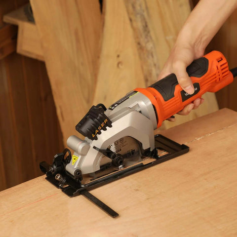 Yunirvana mini circular saw with laser guide, orange/black handheld power tool cutting wood.