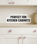 Pink Ceramic Drawer Knobs 12 Piece Set With Floral Cabinet Pulls on white kitchen cabinets, adding a stylish touch.