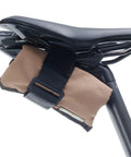 Blossom Roll Bike Saddle Bag With Three Tool Pockets And Repair Kit Organizer Water Resistant Cordura Fabric Lightweight Under Seat Pouch For Road And Mountain Biking Tan attached to bike seat