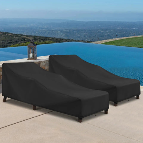 Two black chaise lounge covers by a pool, showing waterproof outdoor protectors with windproof straps on loungers.