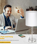 Man using laptop beside 2 Pack Bedside Table Lamps With USB Port And AC Outlet, Pull Chain, White Shade On Nickel Base