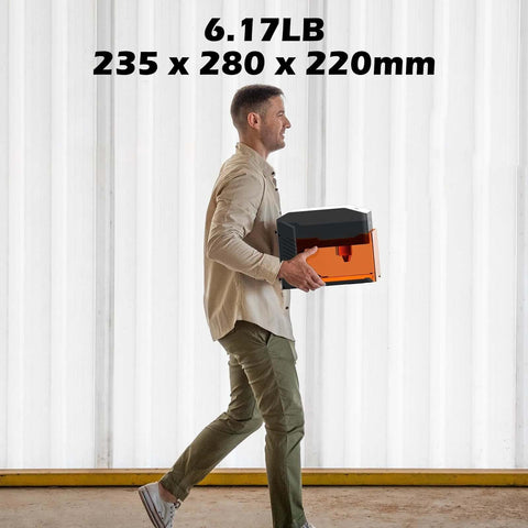 Side view of Genmitsu Kiosk 10W laser engraver with black body and orange acrylic enclosure