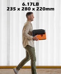 Man carrying 2.5W Laser Engraver Portable Cutter With Acrylic Enclosure, showing size and weight in a workshop setting.