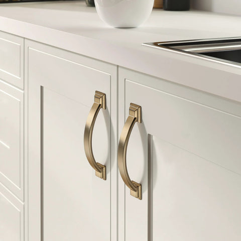 Brushed brass cabinet pulls on white kitchen cabinets, part of the 10 Pack Brushed Brass Cabinet Pulls 3 Inch Hole Center 4.4 Inch Overall Length.